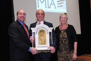 Stefano Follega accepts the Craftsman of the Year Award from MIA